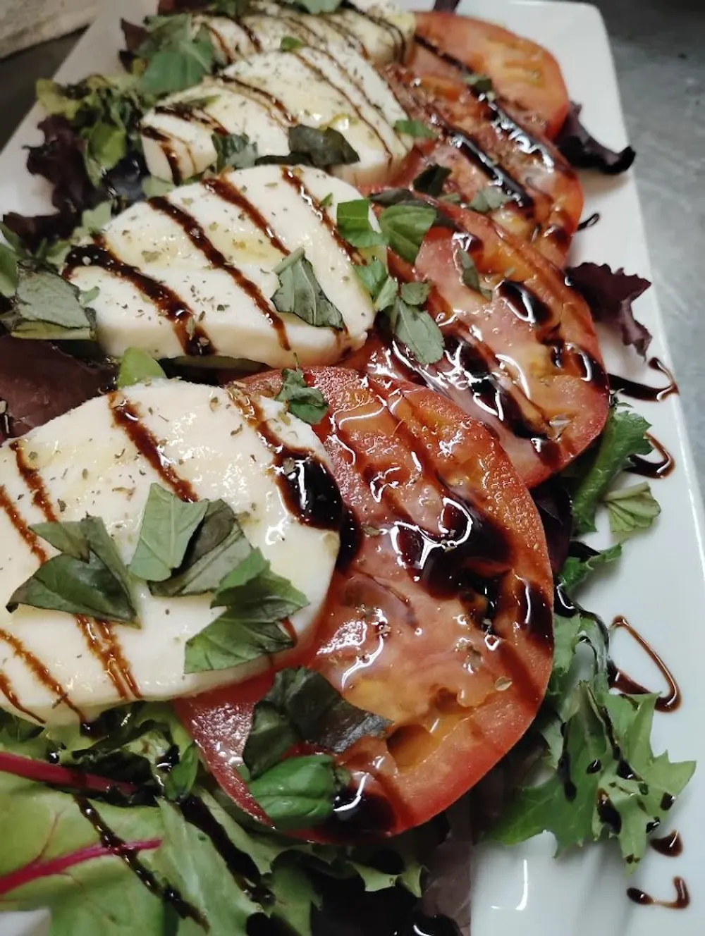 Caprese salad with fresh mozzarella, tomato, and basil